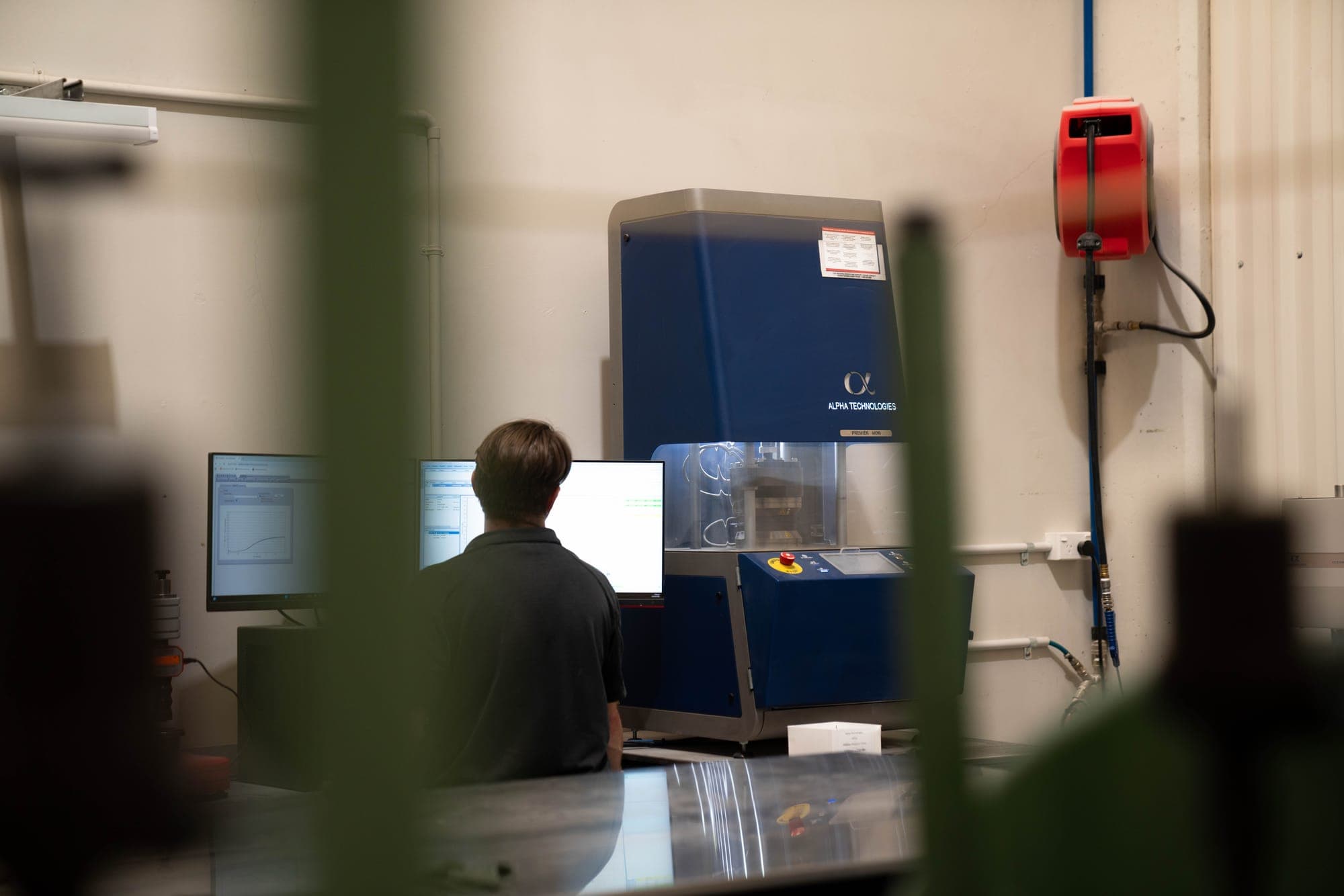 On-site rheometer reading a compound test specimen at the lab bench